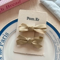 Set of two champagne satin bow hair clips for girls on elegant display card - Yellow