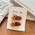 Detail of cute bear hair clips set with yellow hat and red shirt on beige card - Hat Vest Bear / Brown