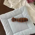 Detail of light blue padded pet cushion and plaid fish plush toy on lace background - Orange Grey Grid Fish (NK1352)