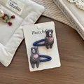 Détail de deux pinces à cheveux en tissu ours avec broderie cœur rose sur carte - Barrette Ours Cœur Marine