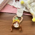 Dettaglio di un elastico per capelli in peluche con una bimba in costume da ananas giallo - Elastico Ananas Giallo