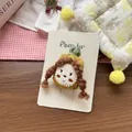 Detail of handmade fabric hair clip featuring a cute girl with a green plaid hat and braids - Yellow Pineapple Hair Clip