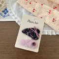 Close-up of floral fabric hair clip and pink quilted hairpins on display card - Light Purple Floral Style