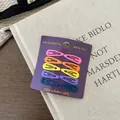 Set mit 10 matten BB-Haarklammern in Macaron-Farben auf violetter Kartonverpackung - Matte Rosa-Serie-Stil