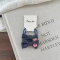 Detail of embroidered strawberry bows on navy blue high-elasticity hair ties for kids - Blue Bow Scrunchie