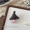 Detailed view of a handmade mushroom fabric brooch featuring a plush green pompom top - Dark Brown Polka Dot (NK1452)