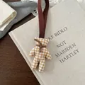 Detail of cute yellow gingham fabric bear charm with ribbed ribbon and neck tie - Yellow Gingham Bear Style
