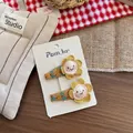Detail von gelb gestickten Blumen-Haarspangen mit Smiley und Blumenband-Umwicklung - Bestickte Haarklammer / Gelb