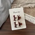 Détail d'un lot de barrettes à cheveux renard en tricot fait main sur carte - Pince à Cheveux Renard