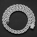 Macro shot of 13mm hip-hop Cuban link chain with baguette cut stones on black background - 16 Inch / Silver