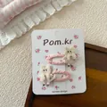 Detalle de dulces horquillas de gato bordado rosa con encaje en tarjeta decorativa - Pinzas BB con Bordado de Gato