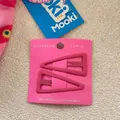 Close-up of a pair of pink triangle metal BB hair clips with a matte finish on a card - Dark Pink (1)