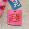 Détail de barrettes à cheveux orange mat en forme de triangle irrégulier sur carte - Orange (16)