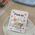 Detail shot of cute fabric hair clip featuring cartoon rabbit and pink rose on floral card - Green Flower Rabbit Cushion Clip