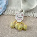 Dettaglio di elastici per capelli con fiocco giallo e ricamo floreale di perle per bimbe - Giallo