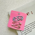 Close-up of four glitter hair clips including heart and water drop shapes on card - Set of 4 / Light Teal Heart + Orange Pink Waterdrop