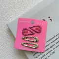 Set of 4 glitter hair clips including pink hearts and gold oval pins on a display card - Set of 4 / Rose Red Heart + Gold Waterdrop