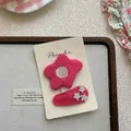 Gros plan sur barrette à fleur rose en tissu et clip à étoiles style fille mignonne - Fleur Et Pince Goutte Étoile