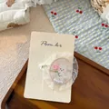 Detail of cute white embroidered bunny hair clip with pearls on a product display card - Flower Rabbit Star Lace Hair Clip