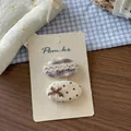 Detail of Korean style fabric bow hair clips for girls on beige display card with lace trim - Oval Plaid Lace