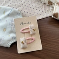 Close-up of pink cat bow hair clips with soft fabric and small bell decorations - Pink Cat Hair Clip