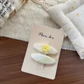 Détail de barrettes goutte enveloppées de tissu avec fleur jaune et motifs à rayures - Pince à Cheveux Fleur en Plastique Ovale