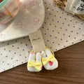 Dettaglio di elastici per capelli a forma di coniglio con cuori e fiocchi gialli - Rabbit Bow