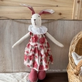 Detail of handmade rabbit doll wearing a red floral vintage dress with white lace collar - Red Floral Style