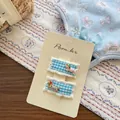 Détail de barrettes à carreaux bleus avec bordure en dentelle et décor de chien mignon - Bleu Gingham Teckel