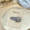 Detailed view of a gingham fabric BB hair clip with a silver sequin heart on card - Black & White Plaid Heart