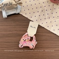 Detailed close-up of cute pink cat embroidery on a high-elastic fabric hair scrunchie - Orange Pink Cat