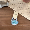 Close-up of cute blue embroidered whale hair tie with gold crown and high-elastic band - Blue Whale