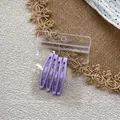 Detailed view of four purple teardrop BB hair clips in a clear retail hanging package - Purple Character / Set of 4