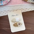 Close-up of 2-piece set girl hair clips with cute button and flower embroidery on fabric - Checkered Flower Style / Coffee Button Hair Clip