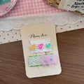 Dettaglio di fermagli per capelli in pizzo con paillettes a cuore e fiori in rete - Molletta per Capelli Pizzo Verde