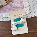Close-up of sweet bow hair clips with brown polka dots on a blue ribbon base - Printed Bow Hair Clip