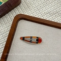 Detailed close-up of retro amber resin hair clip with black stripes and metal clasp - Yellow Brown Waterdrop BB Clip (NK2084-6)