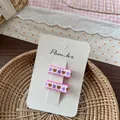 Detail of sweet heart embroidery hair clips with pink lace on white display card - Pink Heart Embroidered Hair Clip