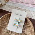 Close-up of sweet heart embroidery hair clips for girls with a wavy edge on card - Green Heart Embroidered Hair Clip