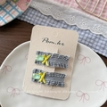 Close-up of plaid fabric hair clips with yellow ribbon bows and green crystals - Black and White Plaid Hair Clip