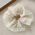 Detail of cream organza oversized scrunchie with plaid texture and sparkling rhinestones - Beige