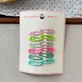 Close-up of 12-piece sweet floral and candy-colored metal water drop hair clips on a card - Green System