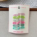 Close-up of 12-piece sweet floral and candy-colored metal water drop hair clips on a card - Green System