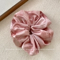 Detailed texture of dusty rose velvet scrunchie with soft sheen and pleated fabric - Pink Scrunchie