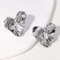 Minimalist silver heart earrings featuring a unique liquid metal fluid texture design - Steel