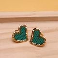 Close-up of heart-shaped crystal earrings with green and black enamel in gold finish - Green