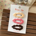Close-up of three wavy hair clips in cream, pink and brown on a Korean display card - Coffee Colors