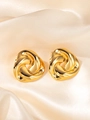 Detail of gold titanium steel earrings with a three-petal spiral twist on silk fabric - Hollow Braided Earrings