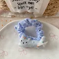 Close-up of blue plaid scrunchie with cute fabric cat doll and delicate lace bow detail - Blue Cat Hair Tie