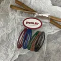 Detailed view of five matte snap hair clips in vintage colors on a card in a clear bag - Matte Oval Hair Clip